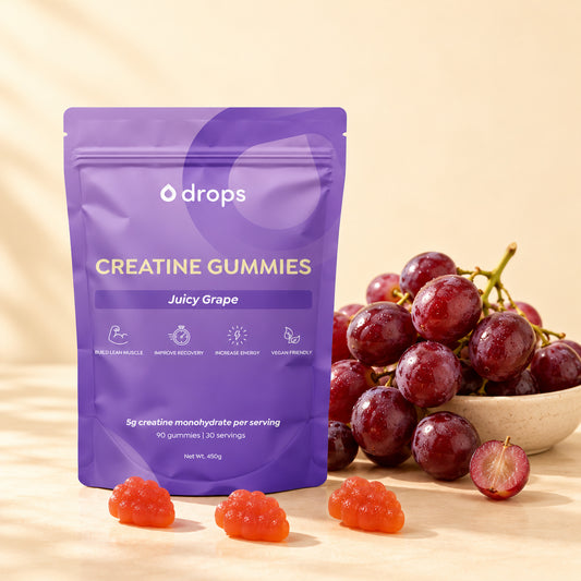 Drops Juicy Grape creatine gummies pouch with fruit and three gummies.